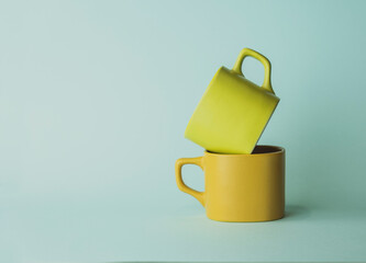 for tea and coffee. yellow cups for drinks. colored utensils.