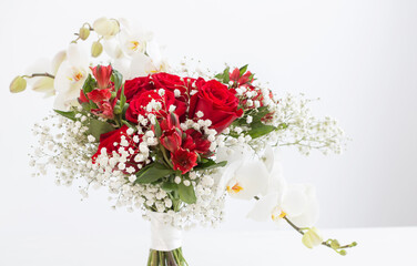 wedding bouquet in red and white colors on white background
