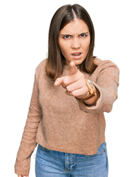 Young beautiful woman wearing casual clothes pointing displeased and frustrated to the camera, angry and furious with you