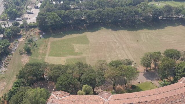 Areal view of the playground of Godrej Udayachal high school. The grass is being cleared with lawn movers. Preparation for upcoming sports events