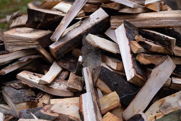 Pile of firewood logs - abstract texture background