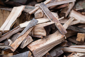Pile of chopped firewood ready for heating home in winter season