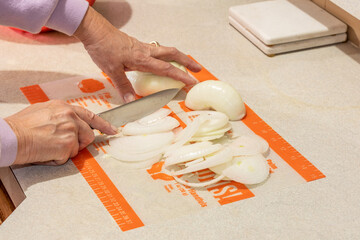 Chopping onions for Thanksgiving dinner.