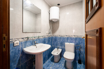 Bright new bathroom interior with colorful mosaic tiles