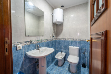 Bright new bathroom interior with colorful mosaic tiles