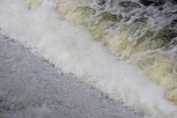 water flowing over a dam on a river