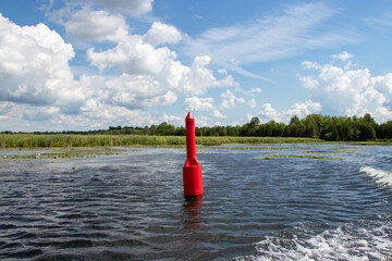 Red navigation marker on the Tay River in Ontario, Canada