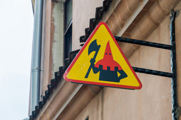 Sign with the image of an executioner over the famous Stone of Misfortune in Lublin, Poland - obrazy, fototapety, plakaty