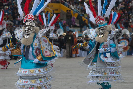 PERU, FEB 03, 2019: people with mask ,playing music  and dancer in carnaval Festival of the Virgen de la Candelaria from Puno typical peruvian dance, La diablada