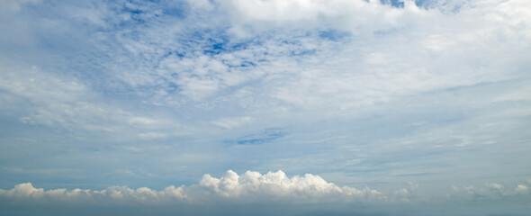 Blue sky with beautiful white clouds. Wide photo.