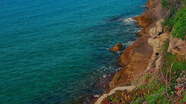 Beautiful landscape of rock formations on the La Pineda beach in Salou Spain.