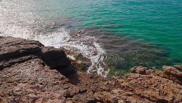 Beautiful landscape of rock formations on the La Pineda beach in Salou Spain.