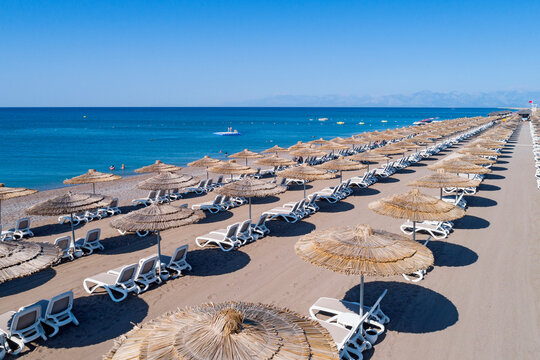 Sandy beaches of the Mediterranean. Kundu - Belek holiday complex with five star hotels. Beach, sea, water sports, parasailing, entertainment and shopping center Aerial view. Antalya, Turkey