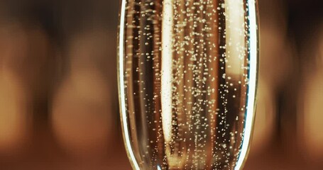 Bubbles, gold and closeup of glass with champagne for party, celebration and event with nobody. Wedding, birthday or restaurant with sparkling wine or alcohol for luxury, congratulations and cheers - Powered by Adobe