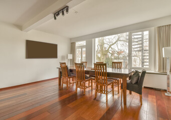 Dining room interior with classy wooden table and chairs