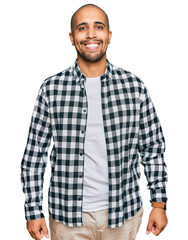 Hispanic adult man wearing casual clothes with a happy and cool smile on face. lucky person.