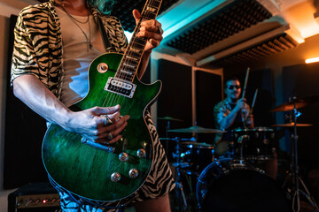 Male musicians performing music in studio
