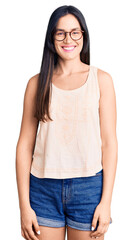 Obraz premium Young beautiful caucasian woman wearing casual clothes and glasses with a happy and cool smile on face. lucky person.