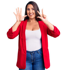 Young beautiful brunette woman wearing elegant clothes showing and pointing up with fingers number eight while smiling confident and happy.