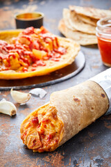 Paneer Garlic paratha roll kathi shawarma wrap isolated on background side view of indian fastfood