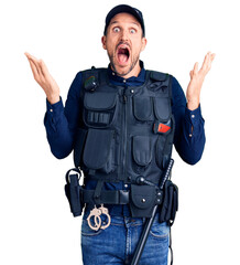 Young handsome man wearing police uniform celebrating crazy and amazed for success with arms raised and open eyes screaming excited. winner concept