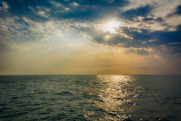 Dramatic sunset over water with beautiful light