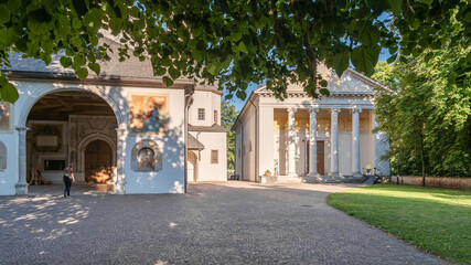 Fototapeta premium The Church of St. Maria Assunta in the Pieve Park - Cavalese, Fiemme valley, Trento district, Dolomites, Trentino Alto Adige, Italy, Europe - Juli 13, 2022