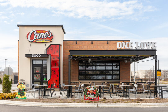 JOLIET, IL, USA - NOVEMBER 24, 2022: Raising Cane's is an American fast food restaurant chain that specializes in chicken fingers.	