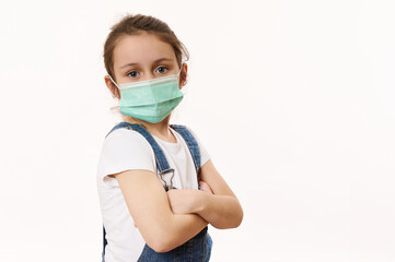 Adorable little girl in protective mask, isolated on white. Virus symptoms. Concept of air pollution, epidemic, influenza, protection from disease. Flu illness. Pediatrics. Medical care. Insurance.