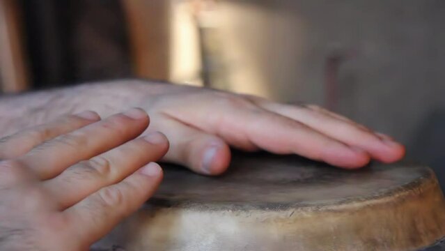 Hands of a Percussionist Playing a Drum. Close Up. 4K Resolution.