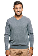 Handsome hispanic man wearing casual clothes with a happy and cool smile on face. lucky person.