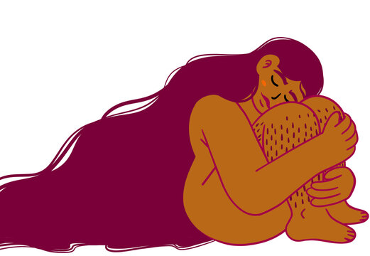Mujer latina abrazando sus piernas