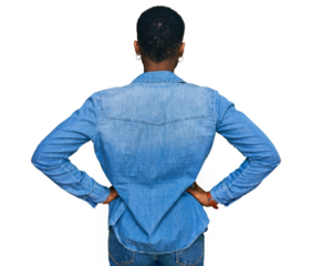 Young african american woman wearing casual clothes standing backwards looking away with arms on body