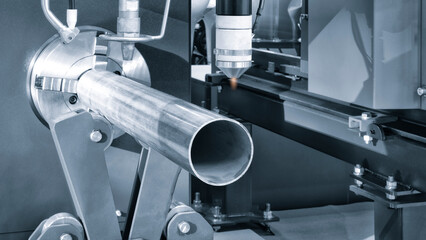 Cutting of metal with sparks fly from laser, modern industrial technology concept