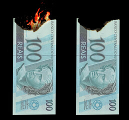 Burning money. Conceptual idea of ​​wasting or losing money on wrong trade. 100 reais burned. Money from Brazil.