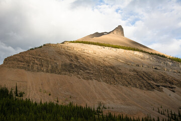 Sun falling on mountain ridge, Kananaskis Country, Alberta