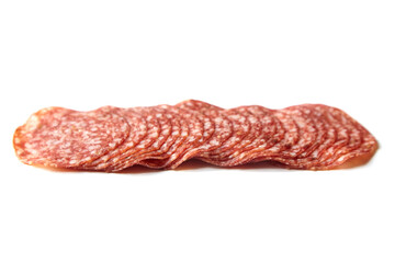 Thin sliced salami sausage isolated on white. Thin sliced italian dry salame