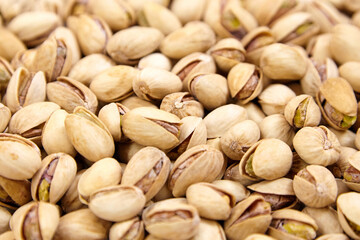 Fototapeta premium Pistachios as food background. Pistachio nuts, soft focus