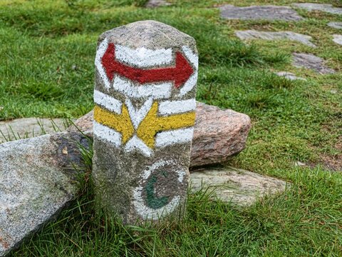 tourist marking signs on a stone