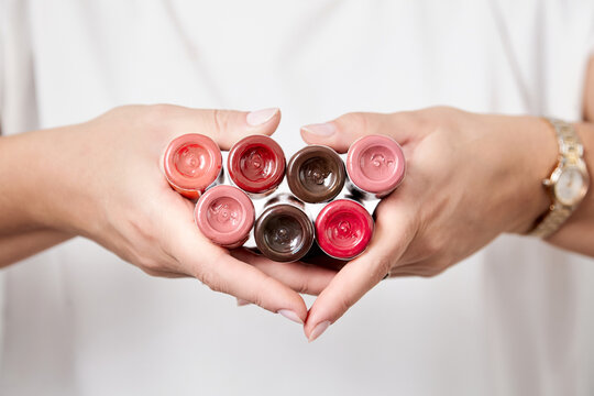Pigments in bottles for tattoos and permanent makeup in woman hands. Tattoo ink