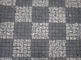 black and white tiles pattern in a street
