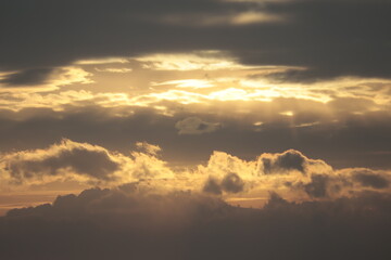 Rays of the sun filtering through the clouds before sunset