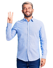 Naklejka premium Young handsome blond man wearing elegant shirt showing and pointing up with fingers number three while smiling confident and happy.