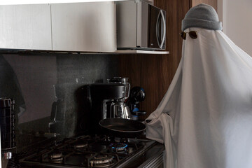 ghost cooking in a kitchen, modern kitchen, ghost white sheet, mexico latin america, mexico