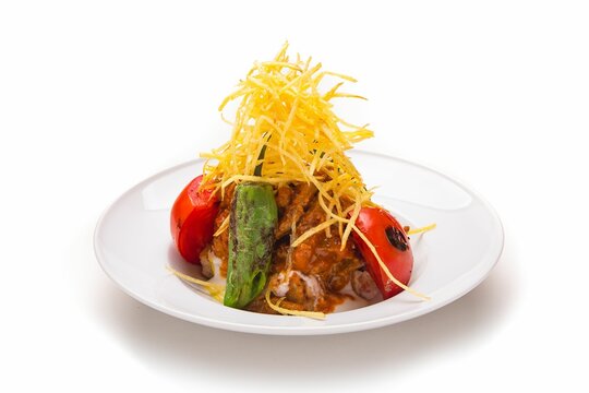 Closeup of a delicious cokertme kebab isolated on a white background