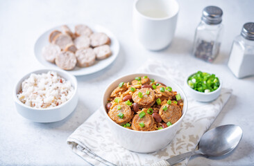 Kidney beans tomato paste sausage rice stew in a bowl
