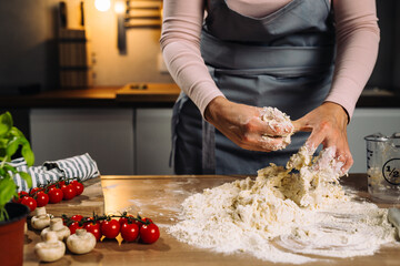 Dough sticks to woman's fingers