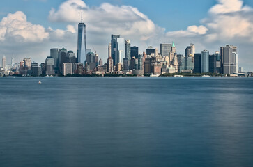 long exposure photography of the Manhattan skyline taken from the Liberty island