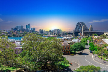 Naklejka premium Sydney Harbour viewed from Observatory Park and overlooking Sydney Rocks area and North Sydney with colourful skies NSW Australia