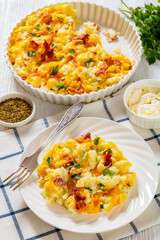 cauliflower bacon cheese casserole on white plate